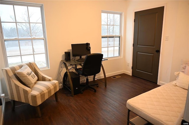 home office with dark wood-type flooring