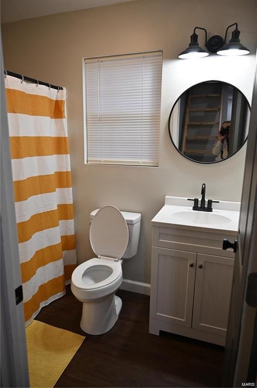 bathroom featuring a shower with curtain, vanity, toilet, and wood-type flooring