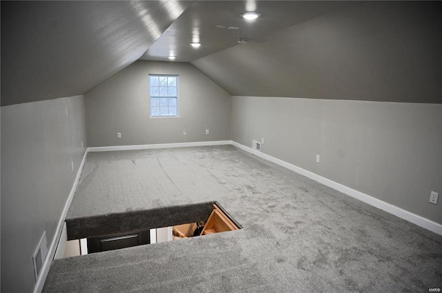 bonus room featuring carpet and vaulted ceiling