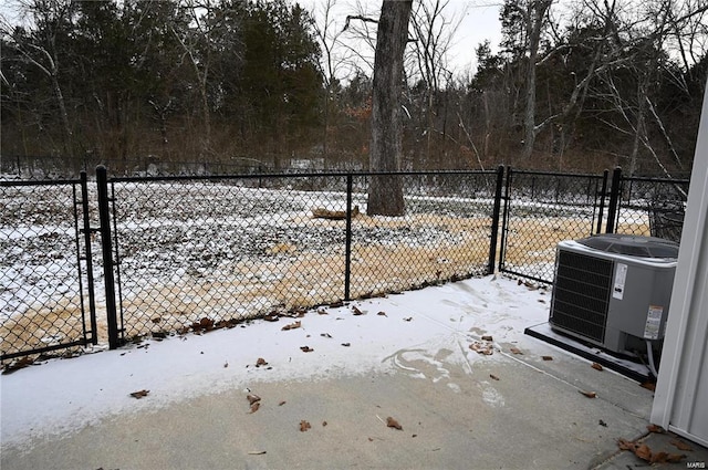 snow covered gate with central air condition unit