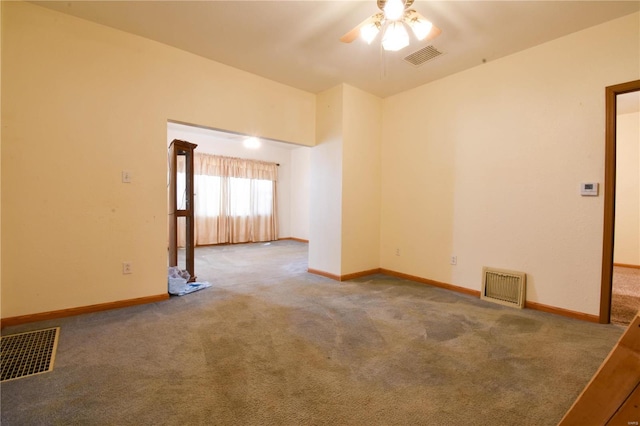 carpeted empty room featuring ceiling fan