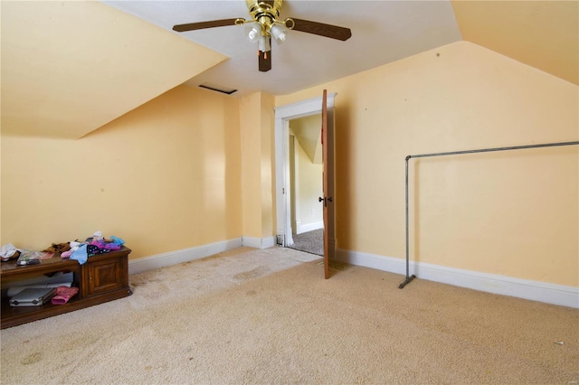 bonus room featuring ceiling fan, light colored carpet, and lofted ceiling