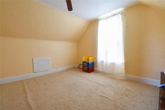 bonus room with carpet flooring, a wealth of natural light, ceiling fan, and lofted ceiling