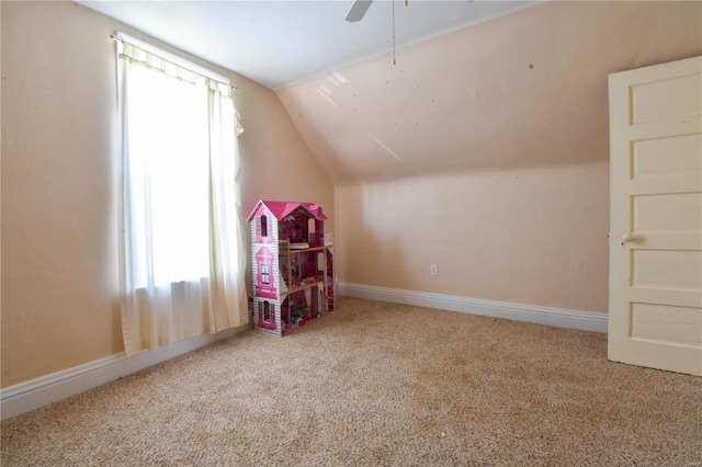 playroom with carpet flooring, ceiling fan, and lofted ceiling