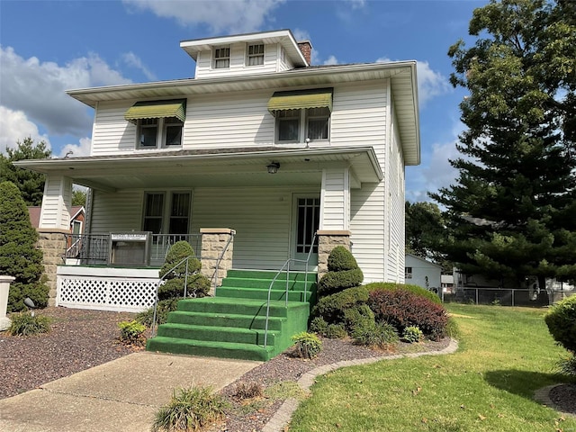 view of front facade with a porch and a front lawn