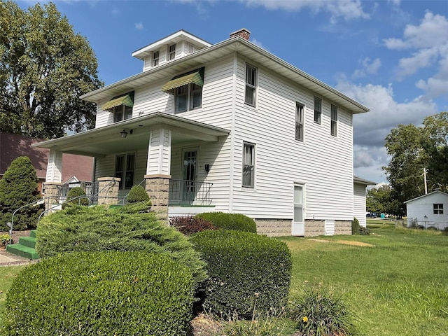 view of front of house featuring a front lawn and a porch