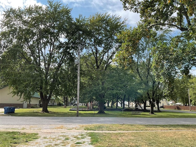 view of home's community with a yard