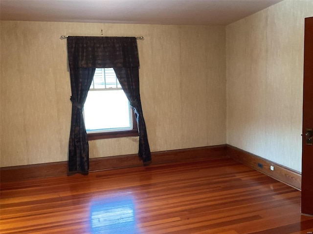 unfurnished room featuring wood-type flooring