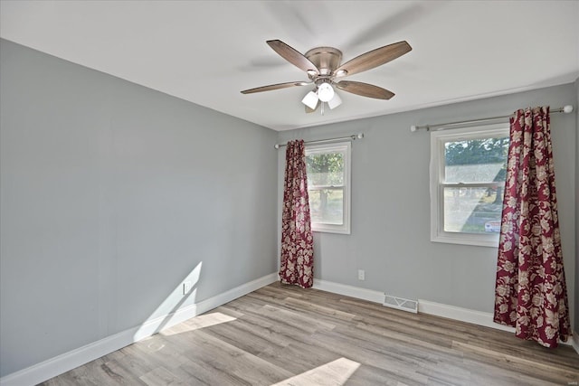 unfurnished room featuring light hardwood / wood-style floors and ceiling fan