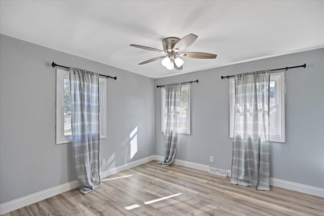 unfurnished room featuring light wood-type flooring and ceiling fan