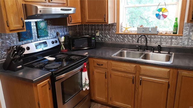 kitchen with exhaust hood, sink, electric range, and decorative backsplash