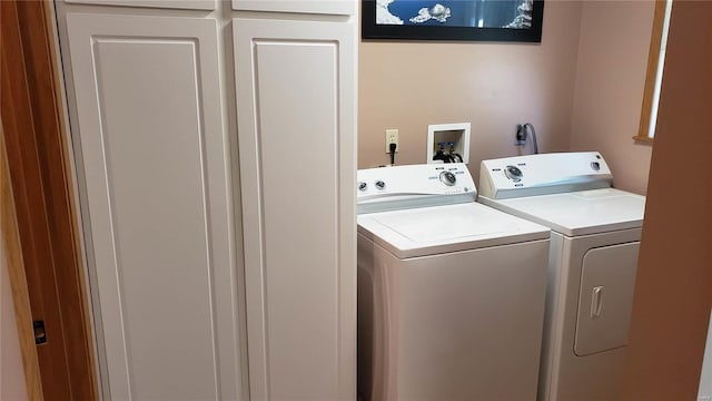 laundry room with independent washer and dryer