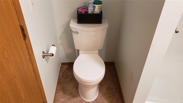 bathroom featuring tile patterned flooring and toilet