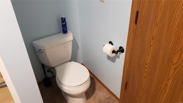 bathroom featuring toilet and tile patterned floors