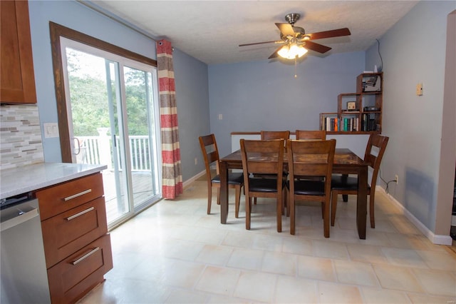 dining area with a textured ceiling and ceiling fan