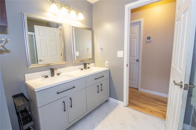 bathroom featuring vanity and hardwood / wood-style floors