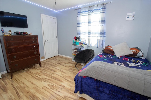 bedroom with light wood-type flooring