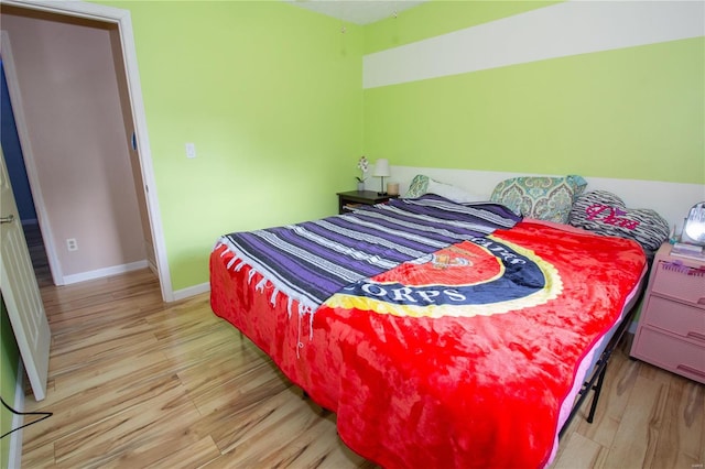 bedroom with light hardwood / wood-style flooring