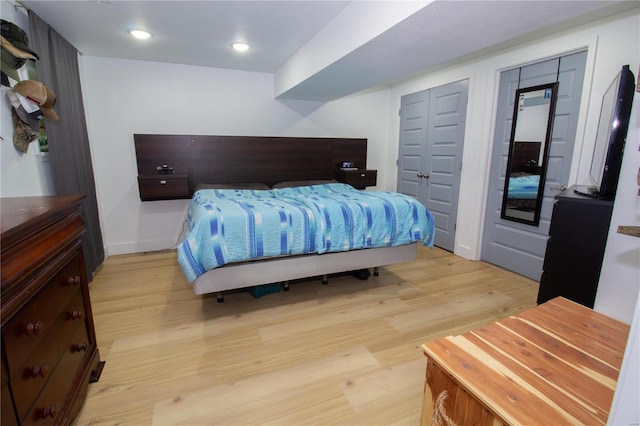 bedroom with light hardwood / wood-style flooring