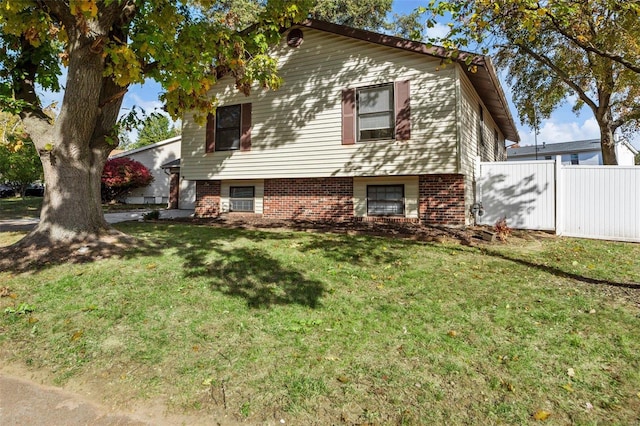 view of side of property featuring a yard