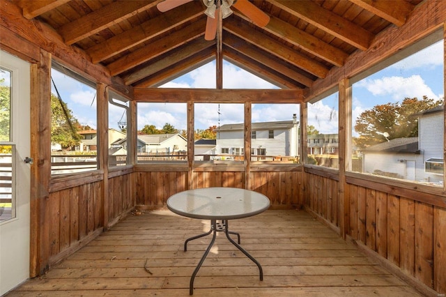 sunroom / solarium featuring ceiling fan, vaulted ceiling with beams, a water view, and wood ceiling