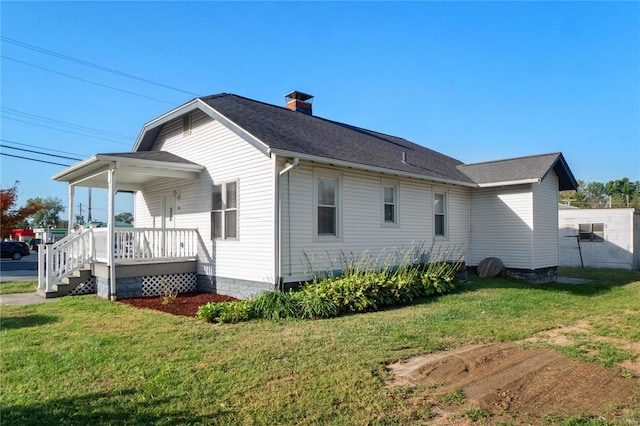 view of property exterior featuring a yard and a porch