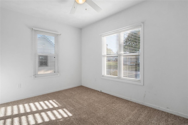 spare room with carpet, plenty of natural light, and ceiling fan