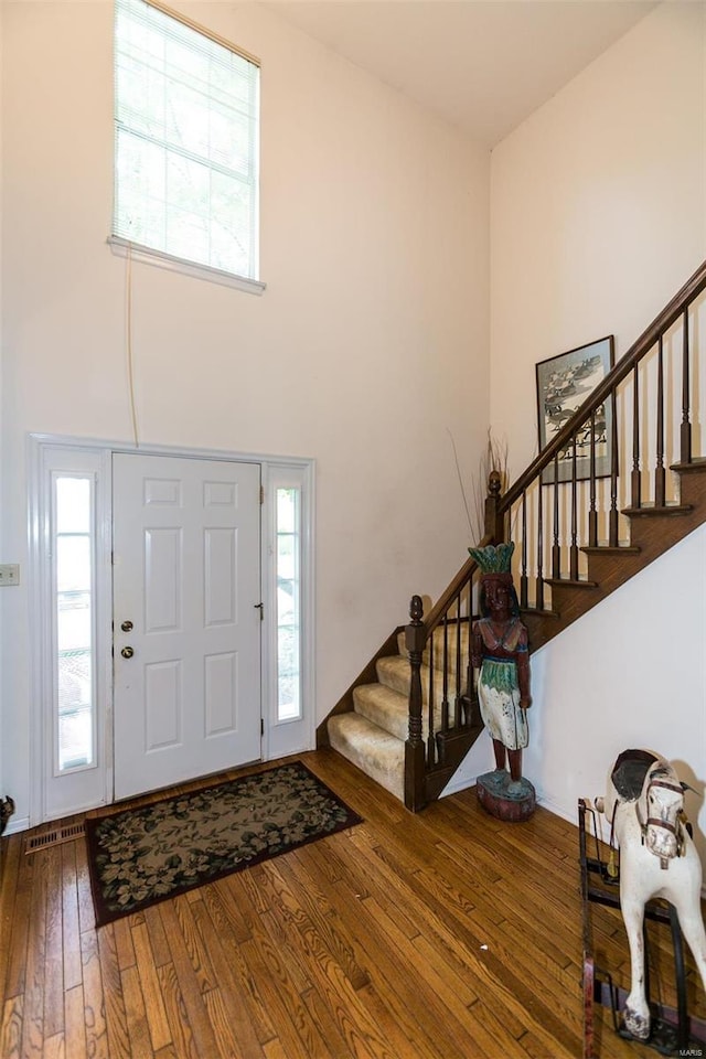 foyer entrance featuring hardwood / wood-style floors