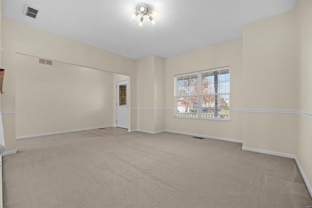 unfurnished room with light colored carpet