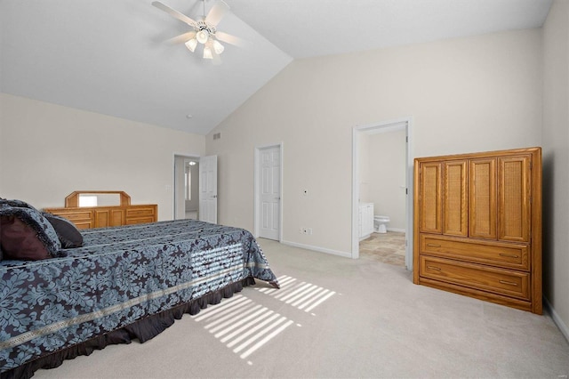 carpeted bedroom with connected bathroom, high vaulted ceiling, and ceiling fan