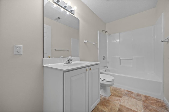 full bathroom featuring vanity, shower / bath combination, a textured ceiling, and toilet