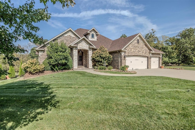 craftsman-style home featuring a garage and a front lawn