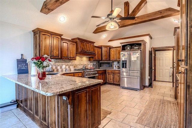 kitchen with kitchen peninsula, stainless steel appliances, vaulted ceiling with beams, light stone countertops, and ceiling fan