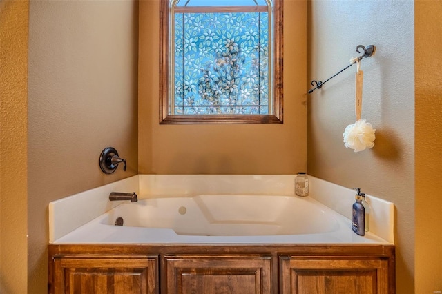 bathroom with a tub to relax in