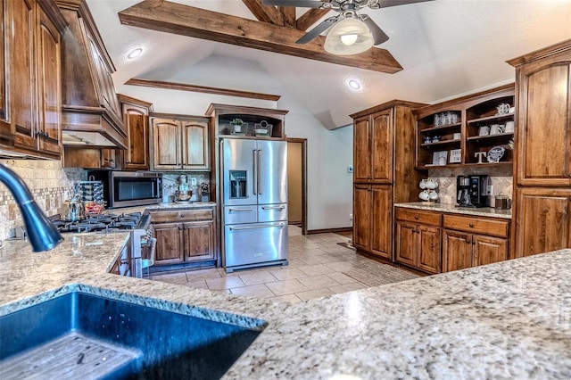 kitchen featuring decorative backsplash, stainless steel appliances, ceiling fan, vaulted ceiling with beams, and sink