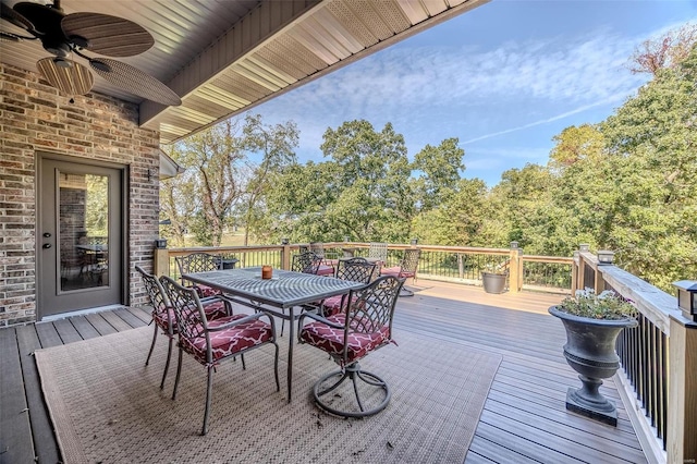 wooden deck featuring ceiling fan