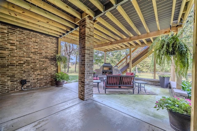 view of patio / terrace featuring exterior fireplace