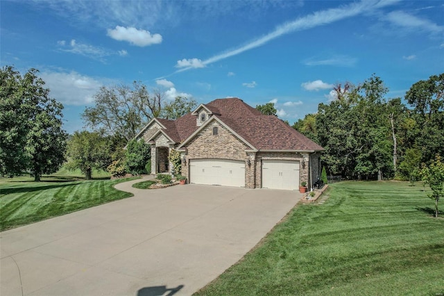 view of front of house featuring a front yard and a garage