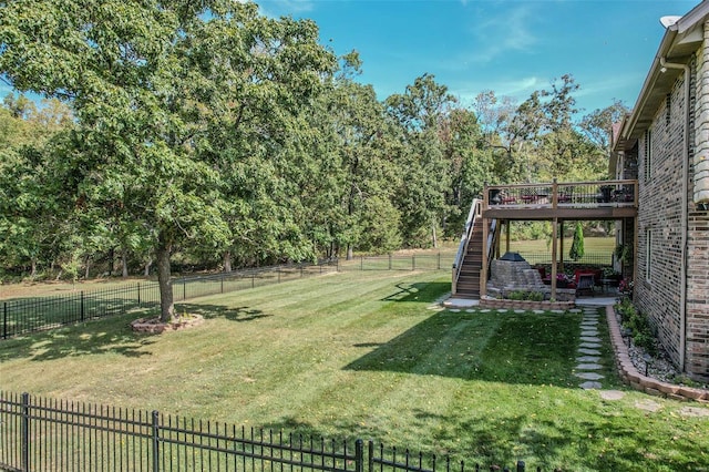 view of yard with a wooden deck