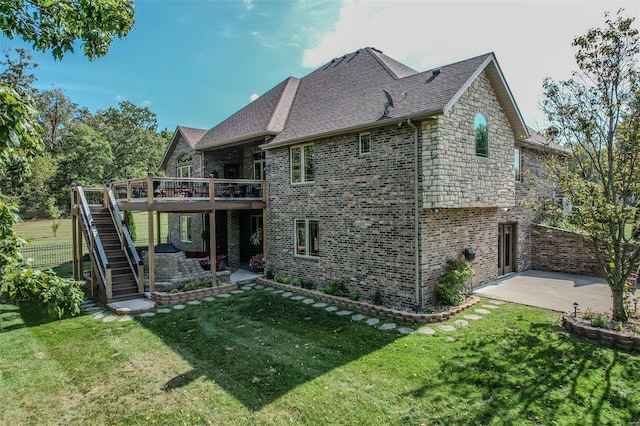 back of house with a patio, a deck, and a yard