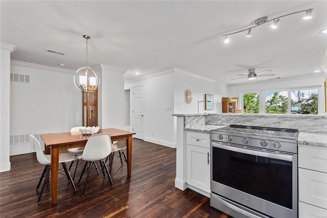 kitchen with light stone countertops, white cabinets, ceiling fan, and stainless steel range oven