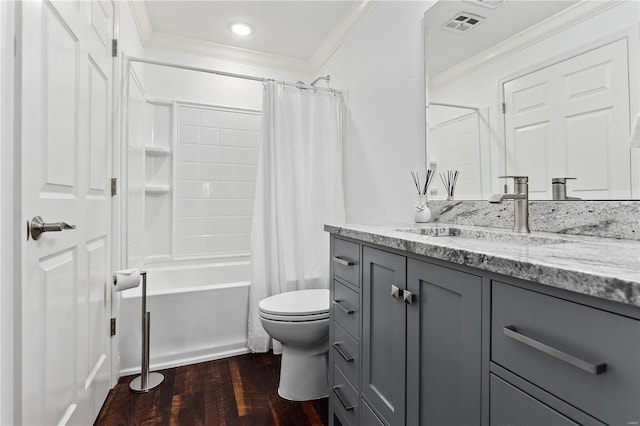 full bathroom featuring vanity, ornamental molding, shower / bath combo, hardwood / wood-style flooring, and toilet