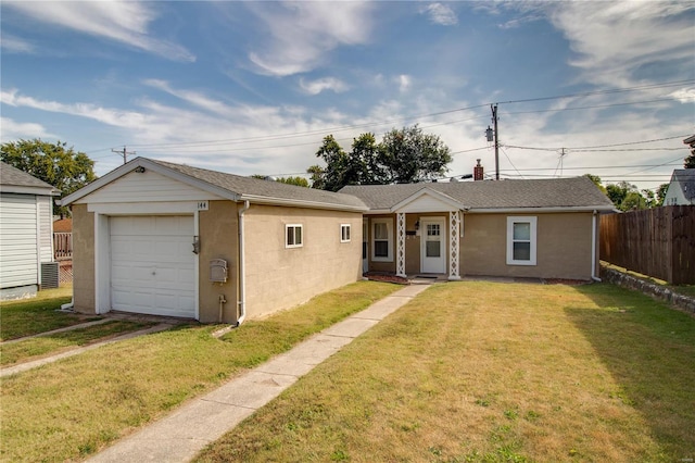 single story home featuring an outdoor structure, a garage, and a front lawn