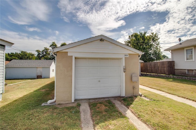 garage with a lawn