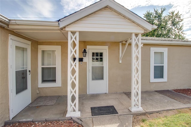 doorway to property featuring a patio