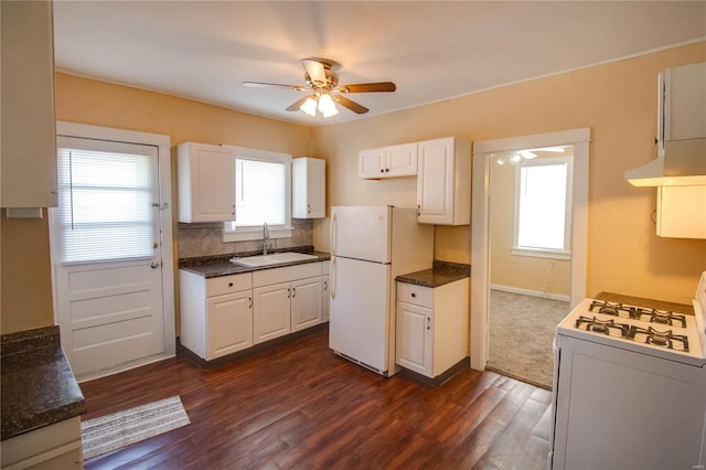 kitchen with white cabinets, white appliances, sink, ceiling fan, and exhaust hood