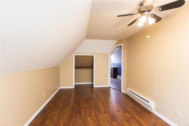 bonus room with a baseboard radiator, vaulted ceiling, ceiling fan, and dark wood-type flooring