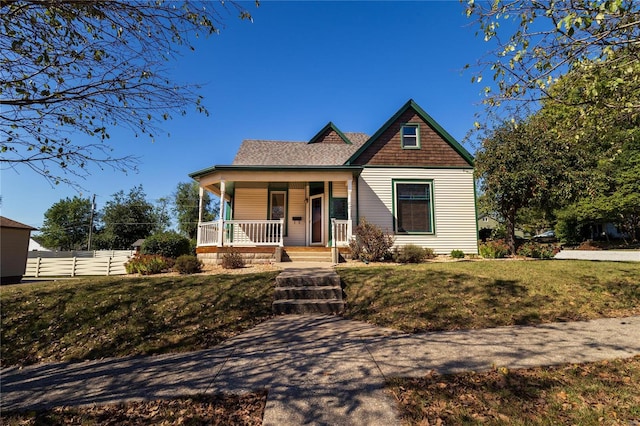 view of front of home with a front lawn and a porch