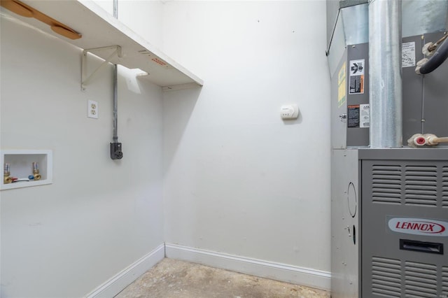 laundry area with heating unit and hookup for a washing machine