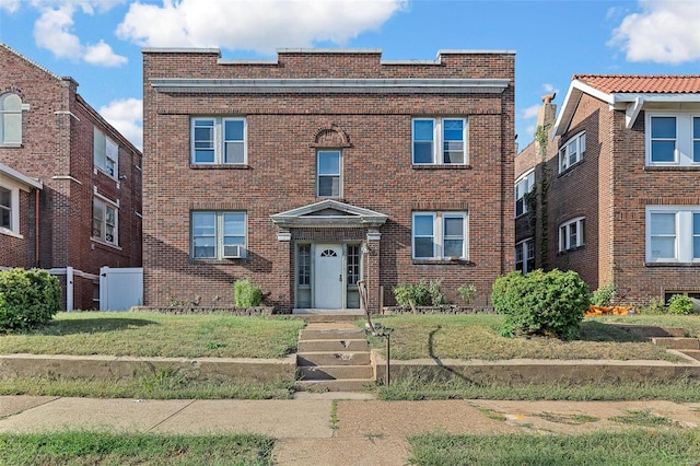 view of front facade featuring cooling unit and a front lawn